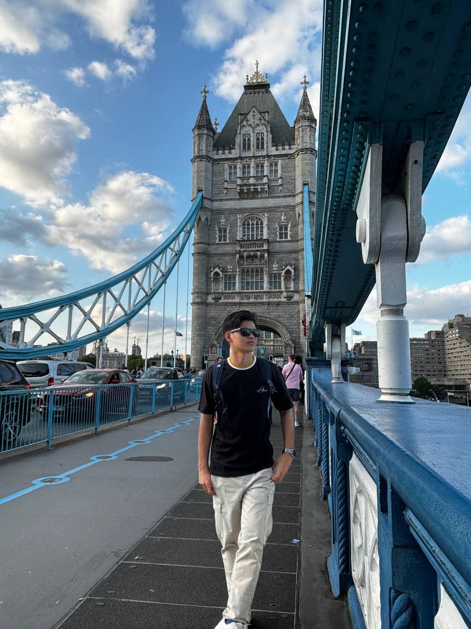 Hafiz, founder of Hafiz MJ Digital, walking across Tower Bridge in London